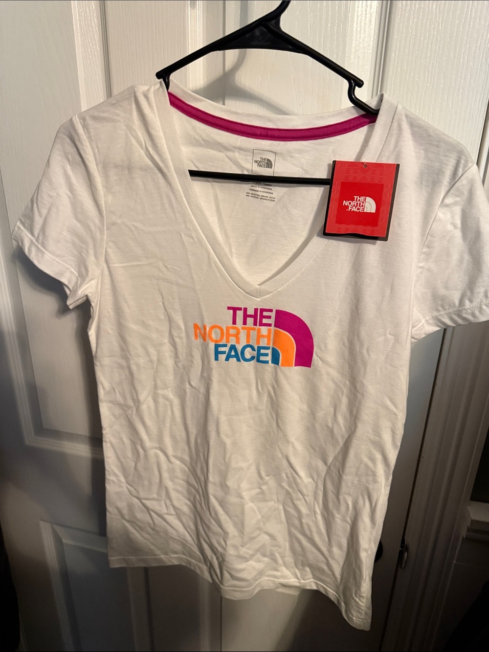 The North Face White V-Neck Tee with Pink, Orange & Blue Logo size medium NWT